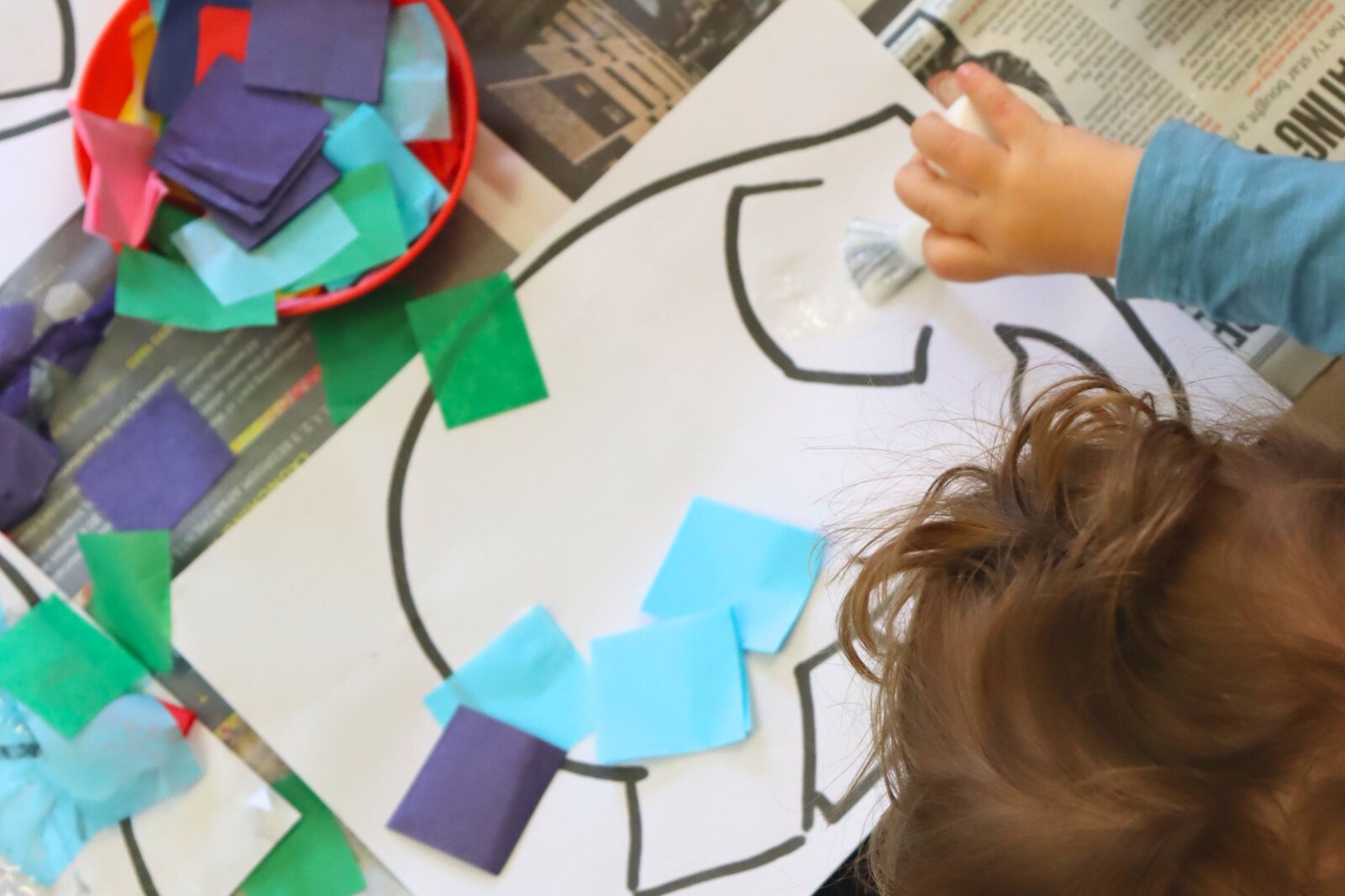 A baby budding learner engaging in messy play, exploring with fun