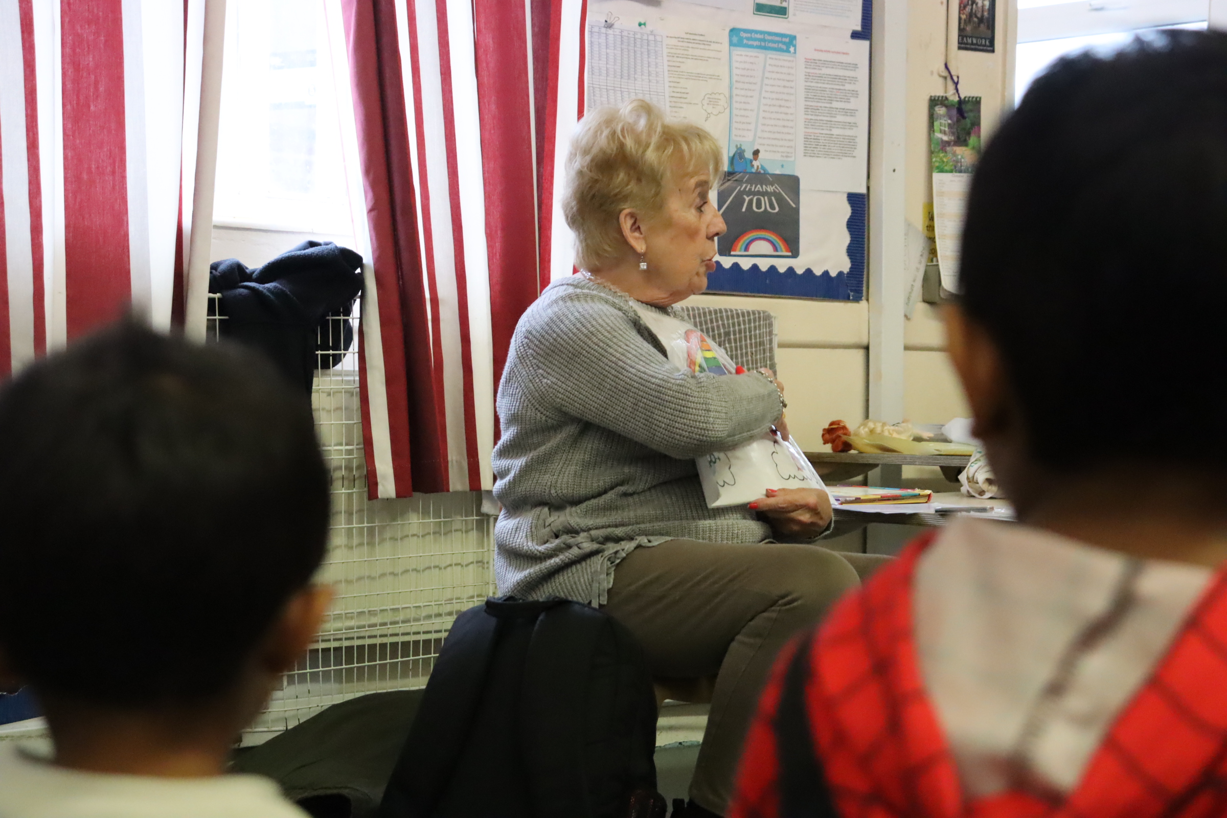 French teacher captured whilst reading a story to Budding learners in French