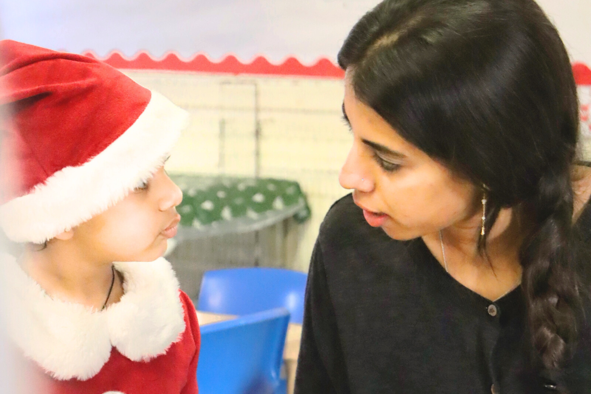 one of Budding Learners' toddlers having fun during summer with water in the nursery's garden