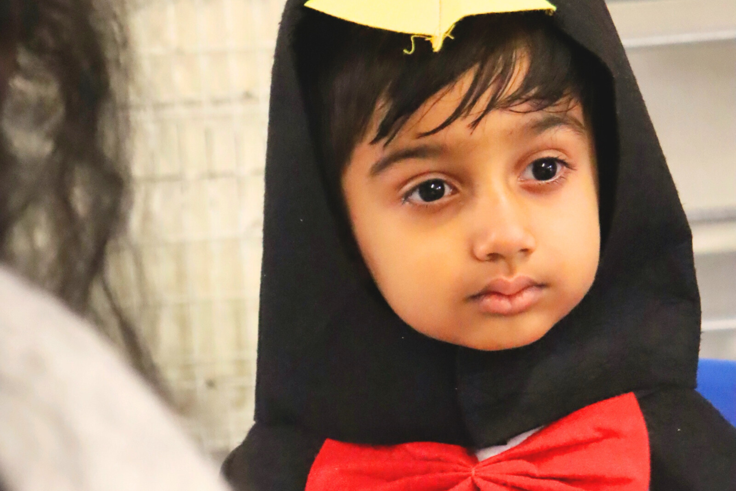 one of Budding Learners' toddlers having fun during summer with water in the nursery's garden