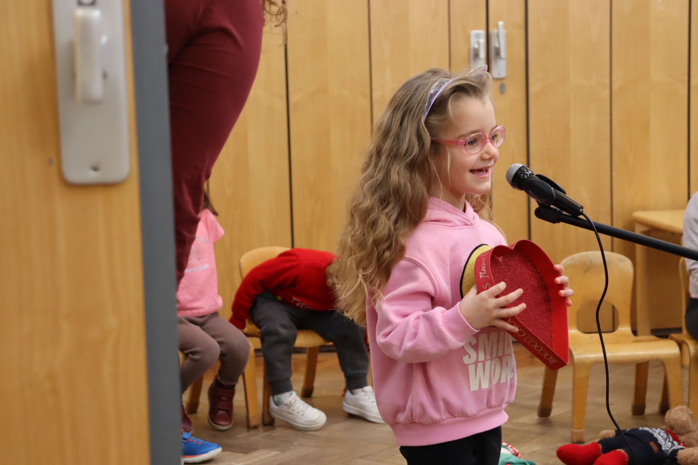 A preschooler rehearsing her parts for the Christmas show