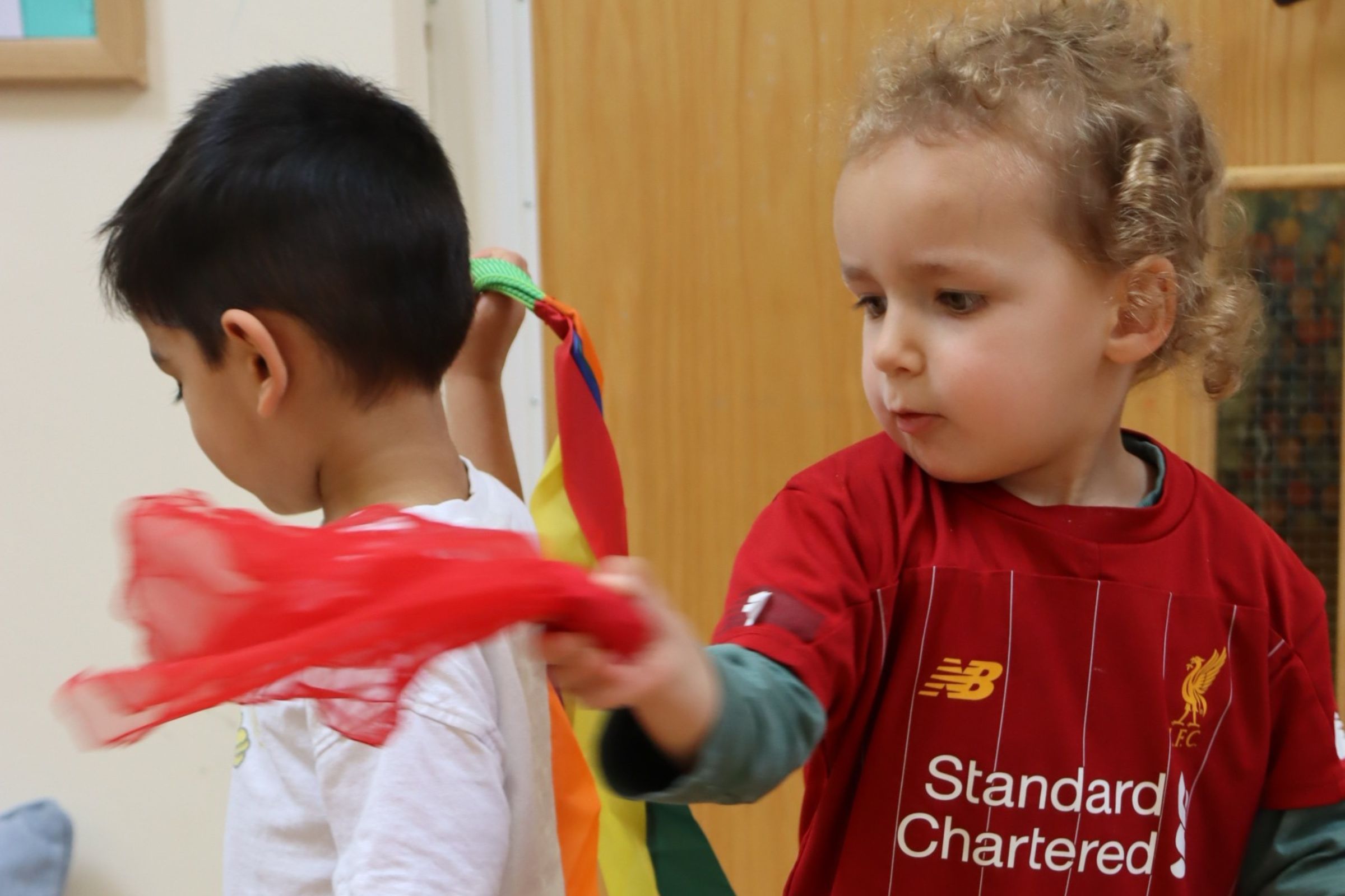 Two toddlers dancing to music on Fun Friday