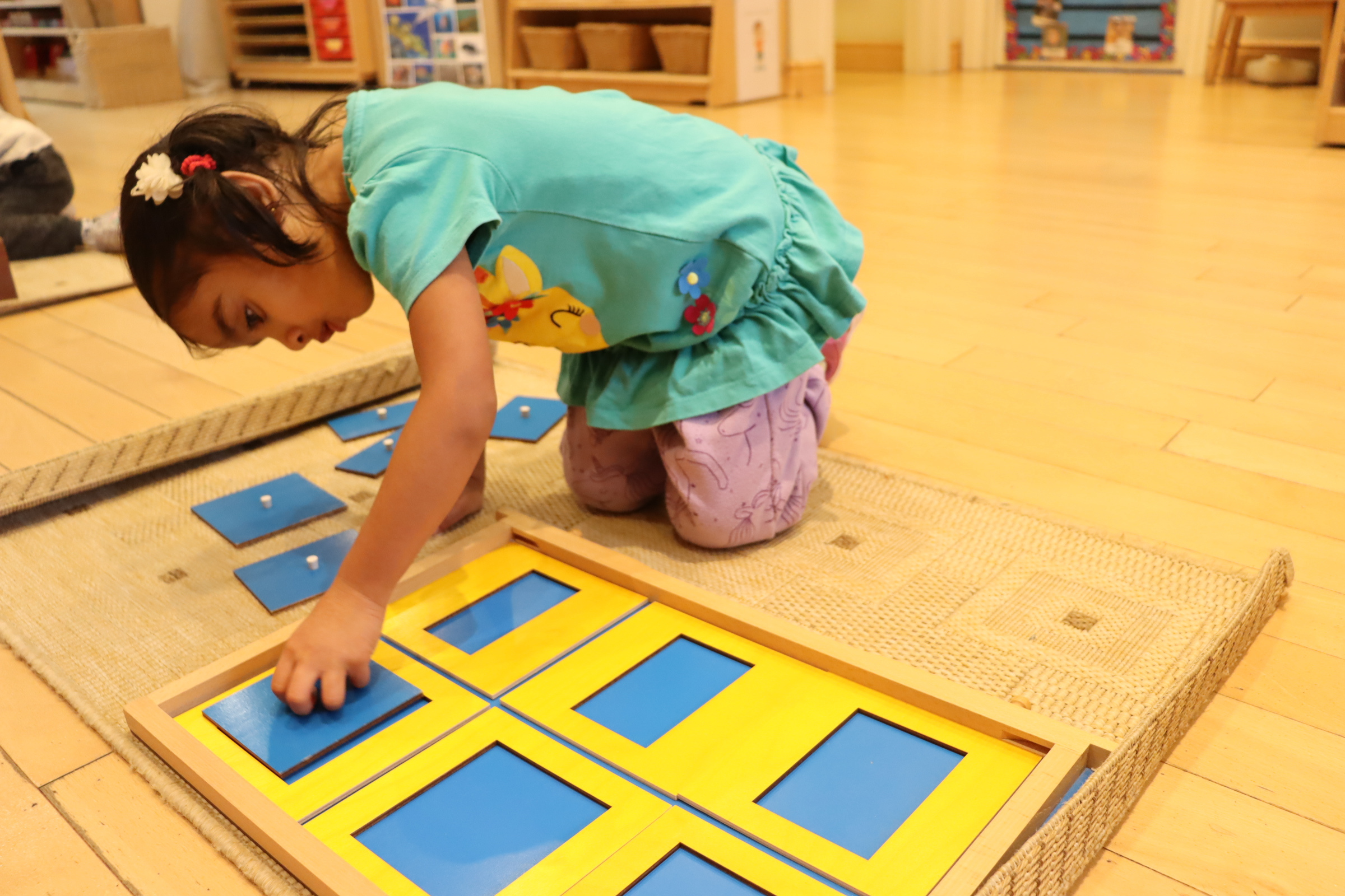 child doing a montessori activity