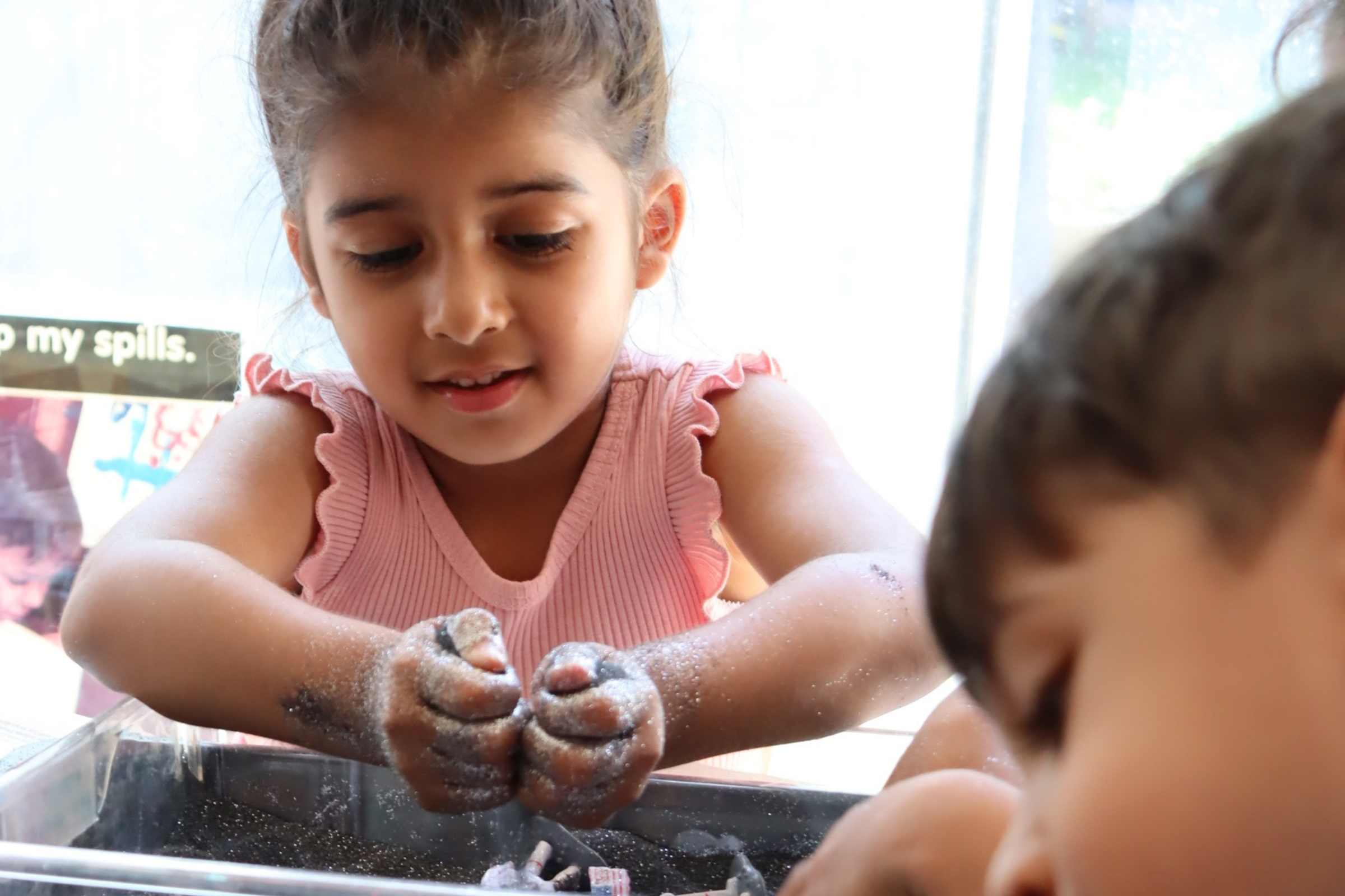 child playing with moonsand